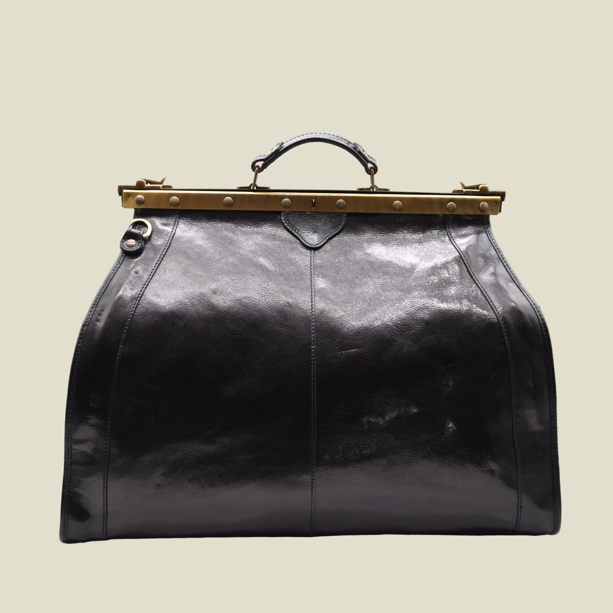 A black leather doctor bag handbag with a gold-tone metal frame clasp and top handle, shown against a plain white background.