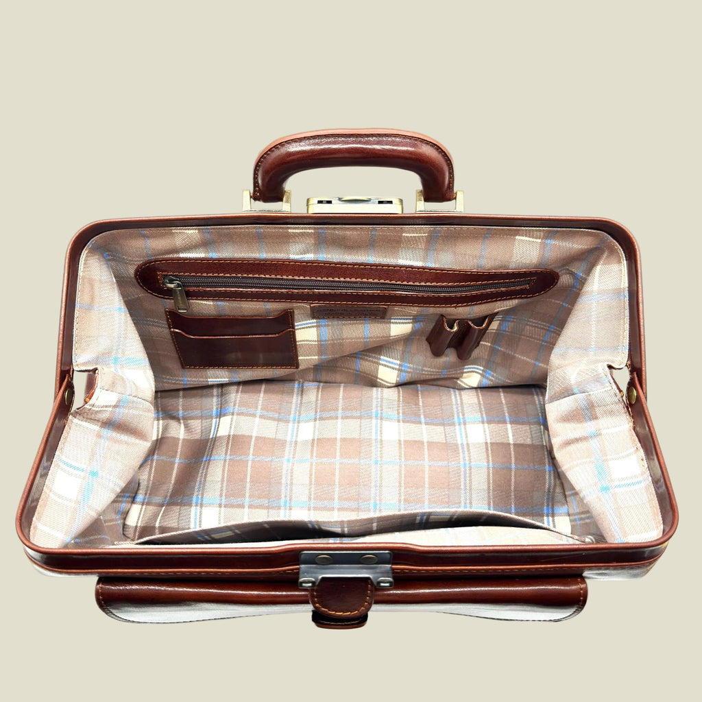 An open vintage-style briefcase or travel bag with a brown leather handle and trim, featuring a beige and light blue plaid lining.