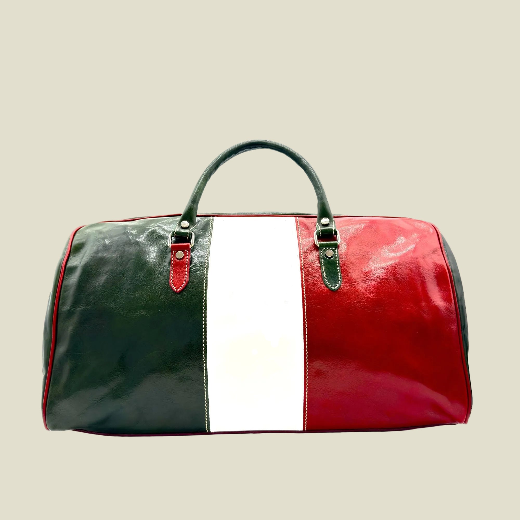 A glossy leather duffel bag featuring the vertical tricolor design of green, white, and red, with dark green handles and silver-tone hardware, set against a plain white background.