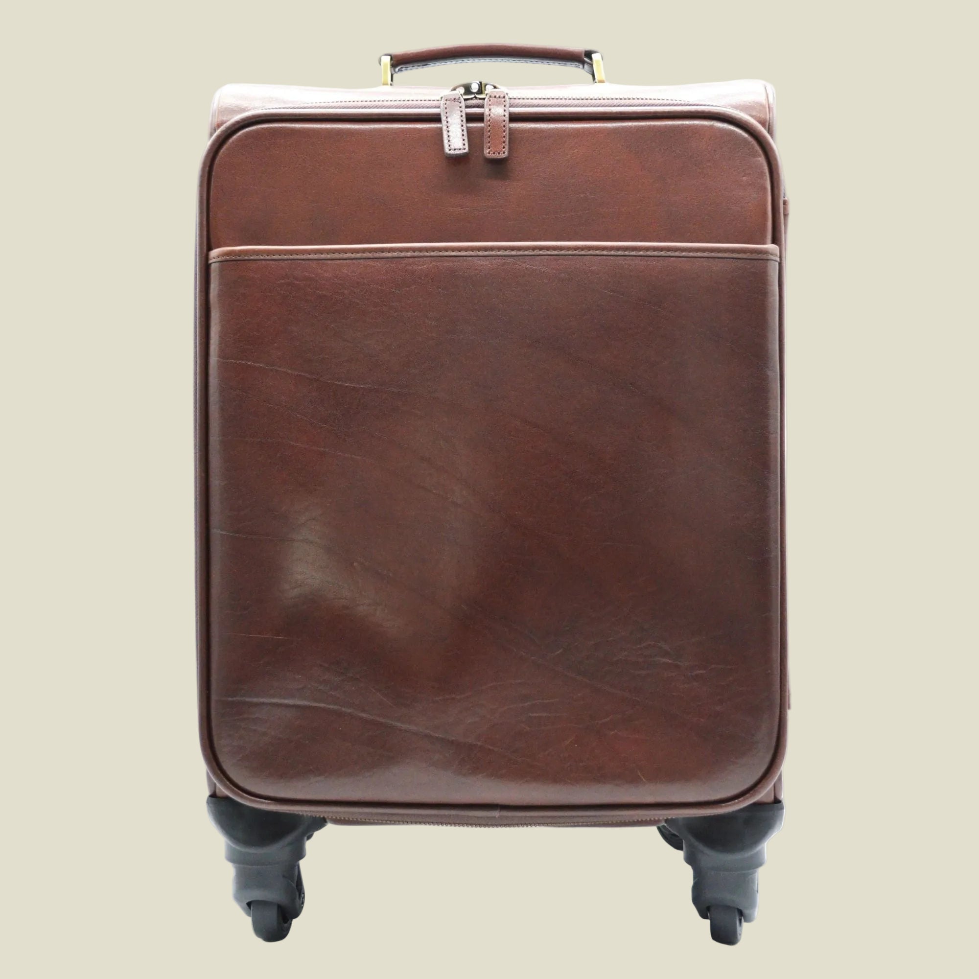 A brown leather rolling suitcase with a front zippered pocket, top handle, and dual spinner wheels, shown against a plain white background.