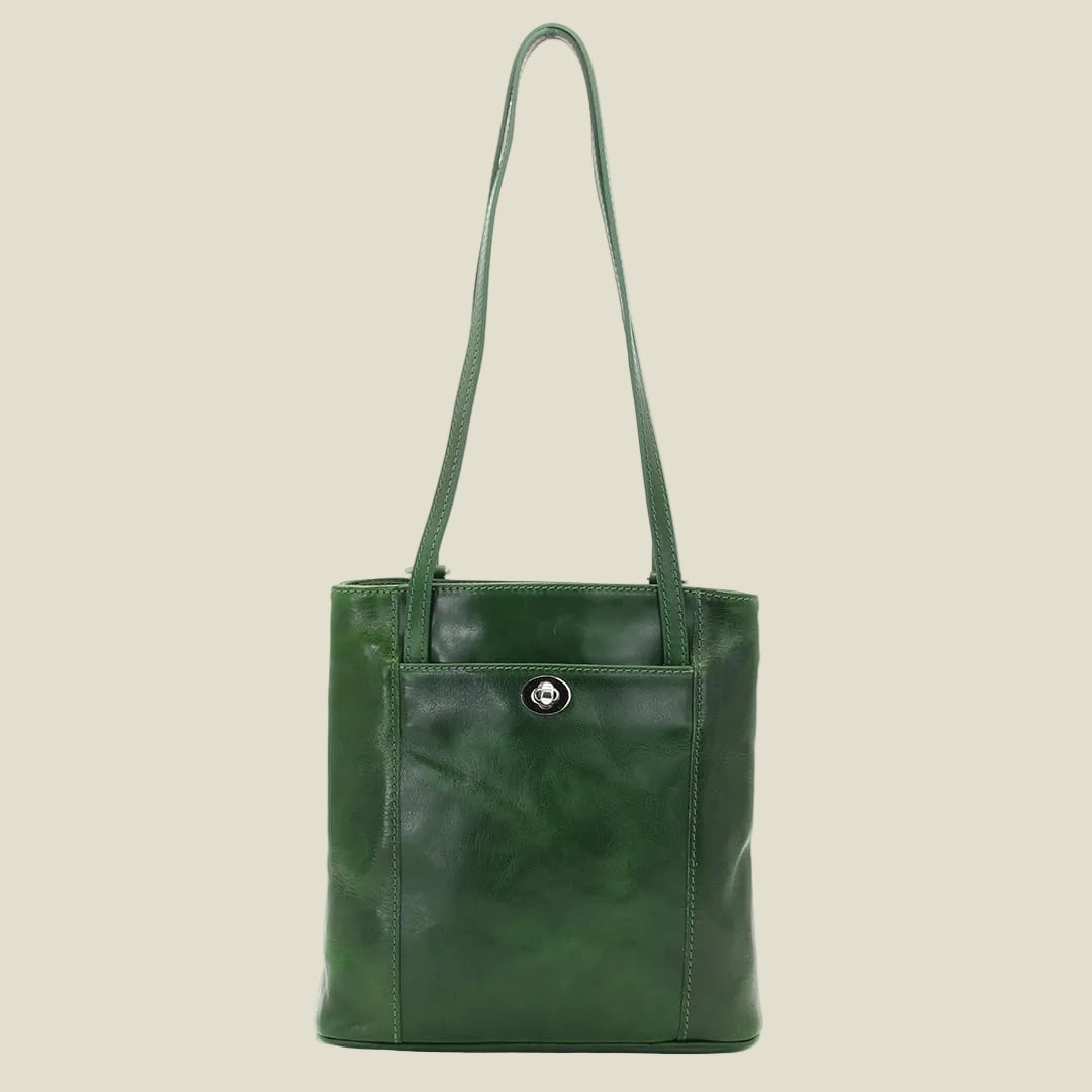 A green leather tote bag with a single shoulder strap and a front pocket featuring a small silver-tone snap button, shown against a plain white background.
