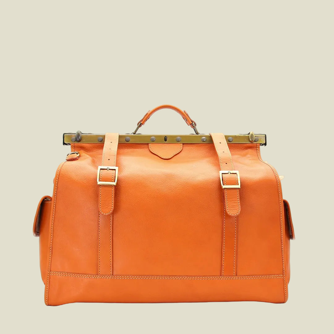 Orange leather bag with straps on a beige background